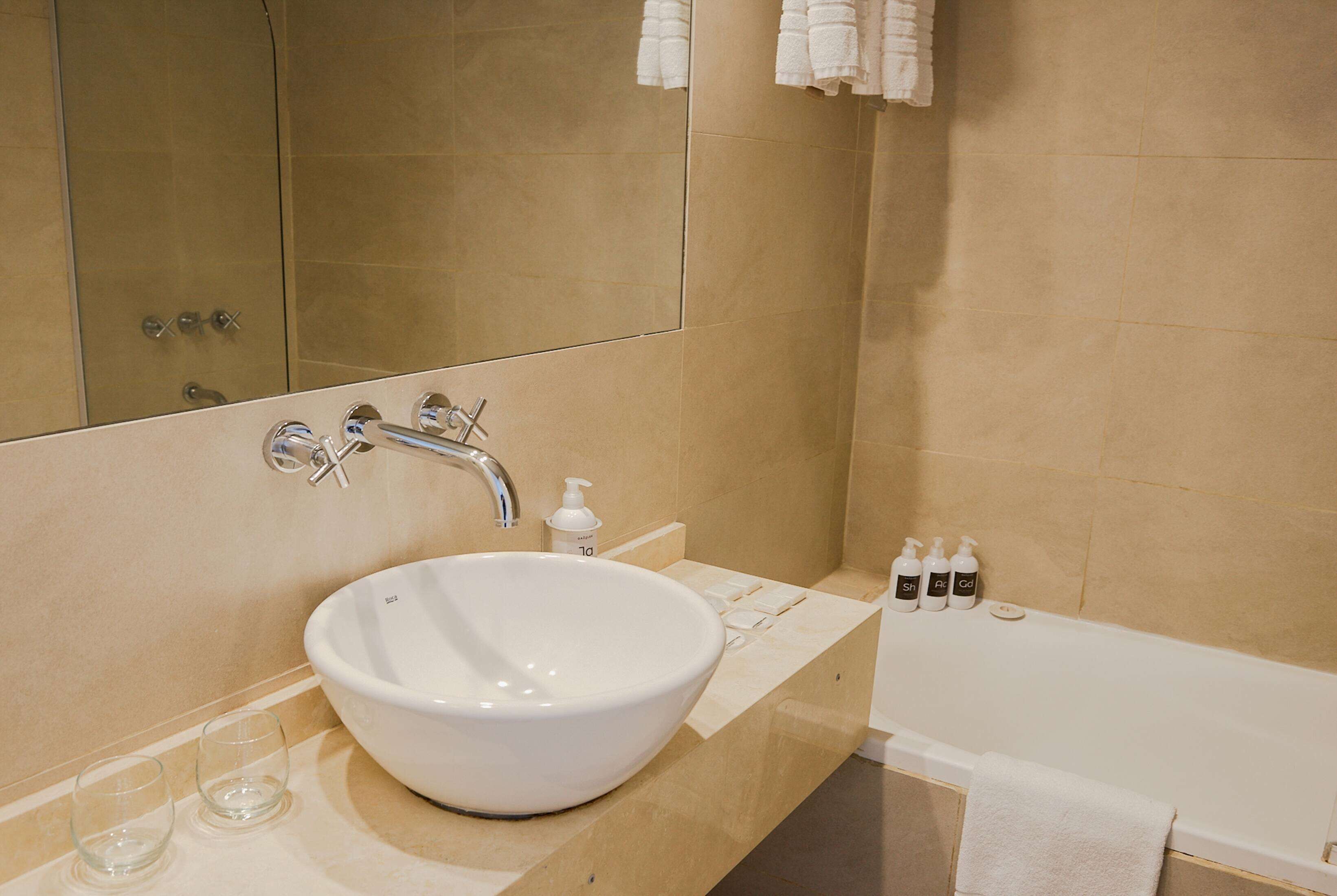 combined shower/bathtub, deep-soaking bathtub, rainfall showerhead