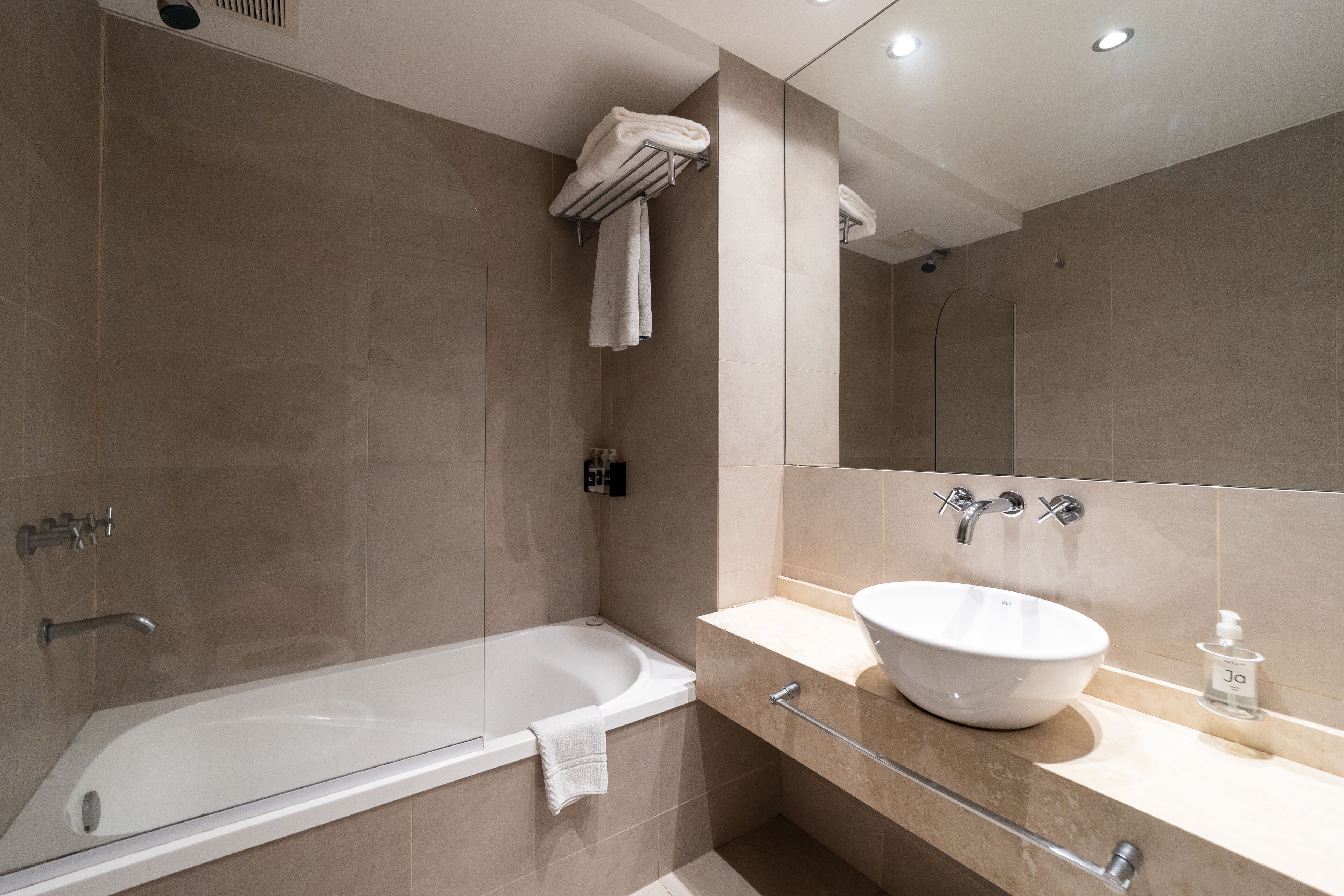 combined shower/bathtub, deep-soaking bathtub, rainfall showerhead