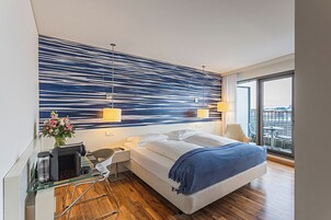 Premium bedding, down comforters, pillowtop beds, minibar