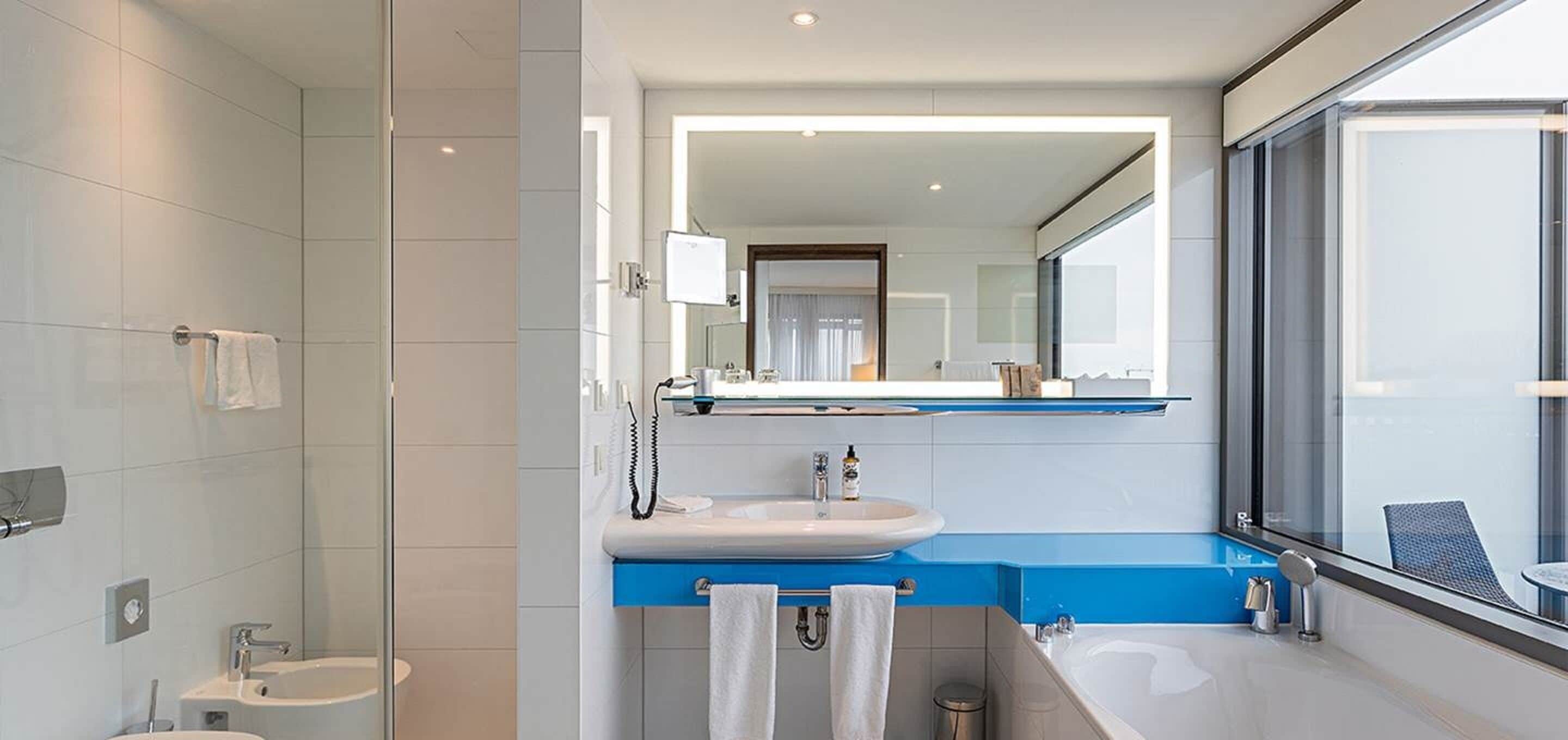 panoramic suite | bathroom | rainfall showerhead, free toiletries, hair dryer, bidet