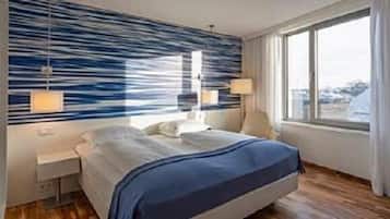 Premium bedding, down comforters, pillowtop beds, minibar