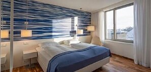 Premium bedding, down comforters, pillowtop beds, minibar