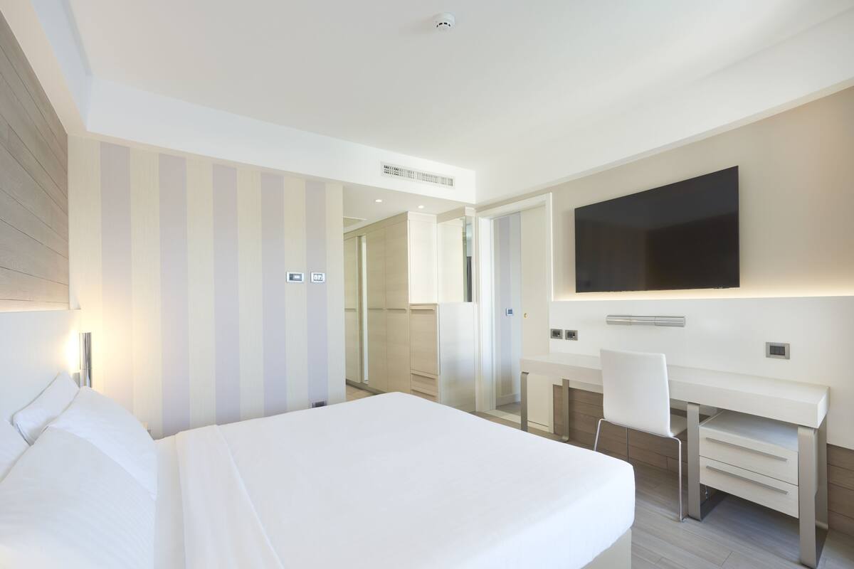 Family Suite, Balcony, Partial Sea View | Minibar, in-room safe, desk, blackout drapes