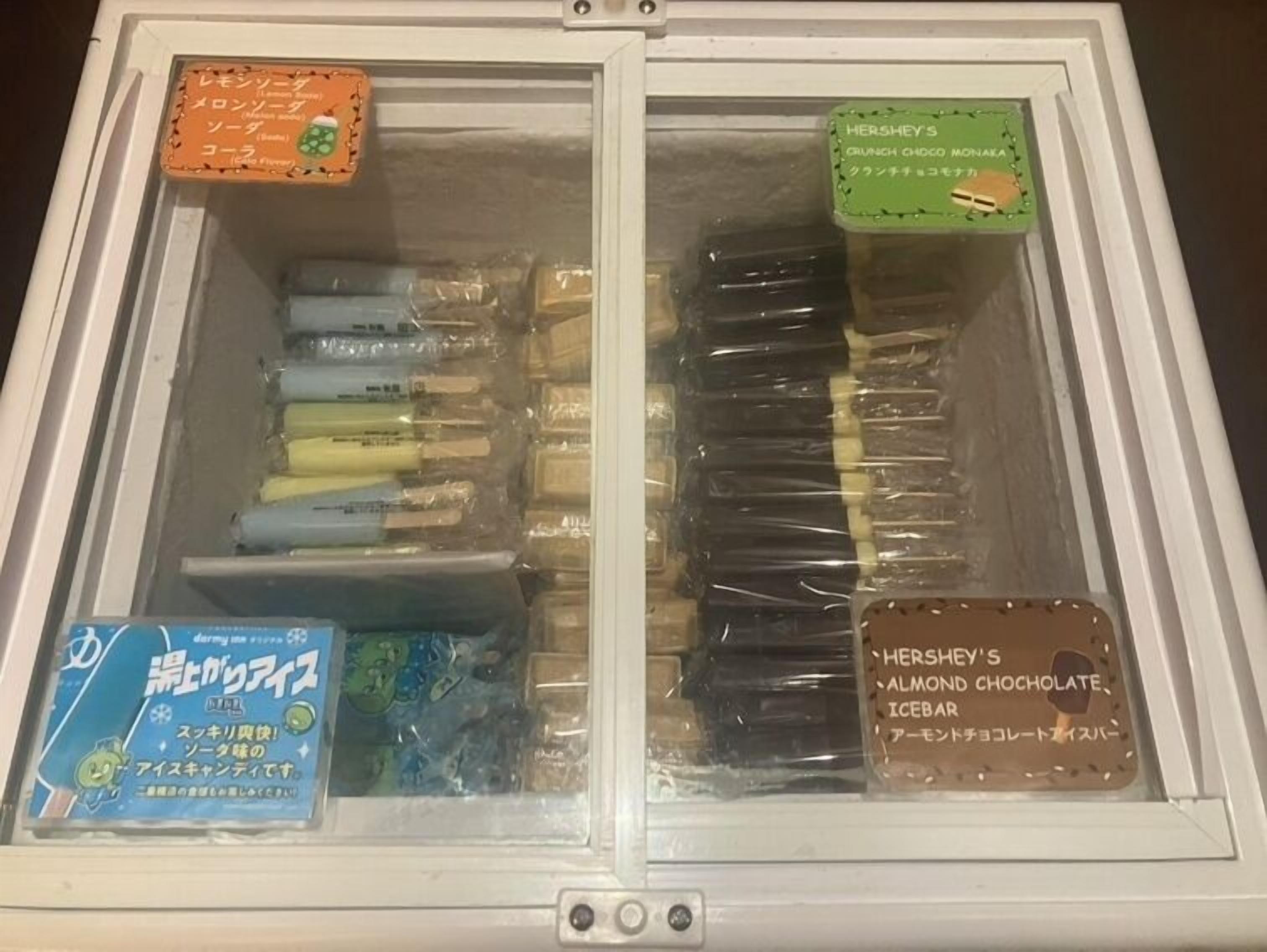 A freezer with two compartments, each containing different packaged food items.