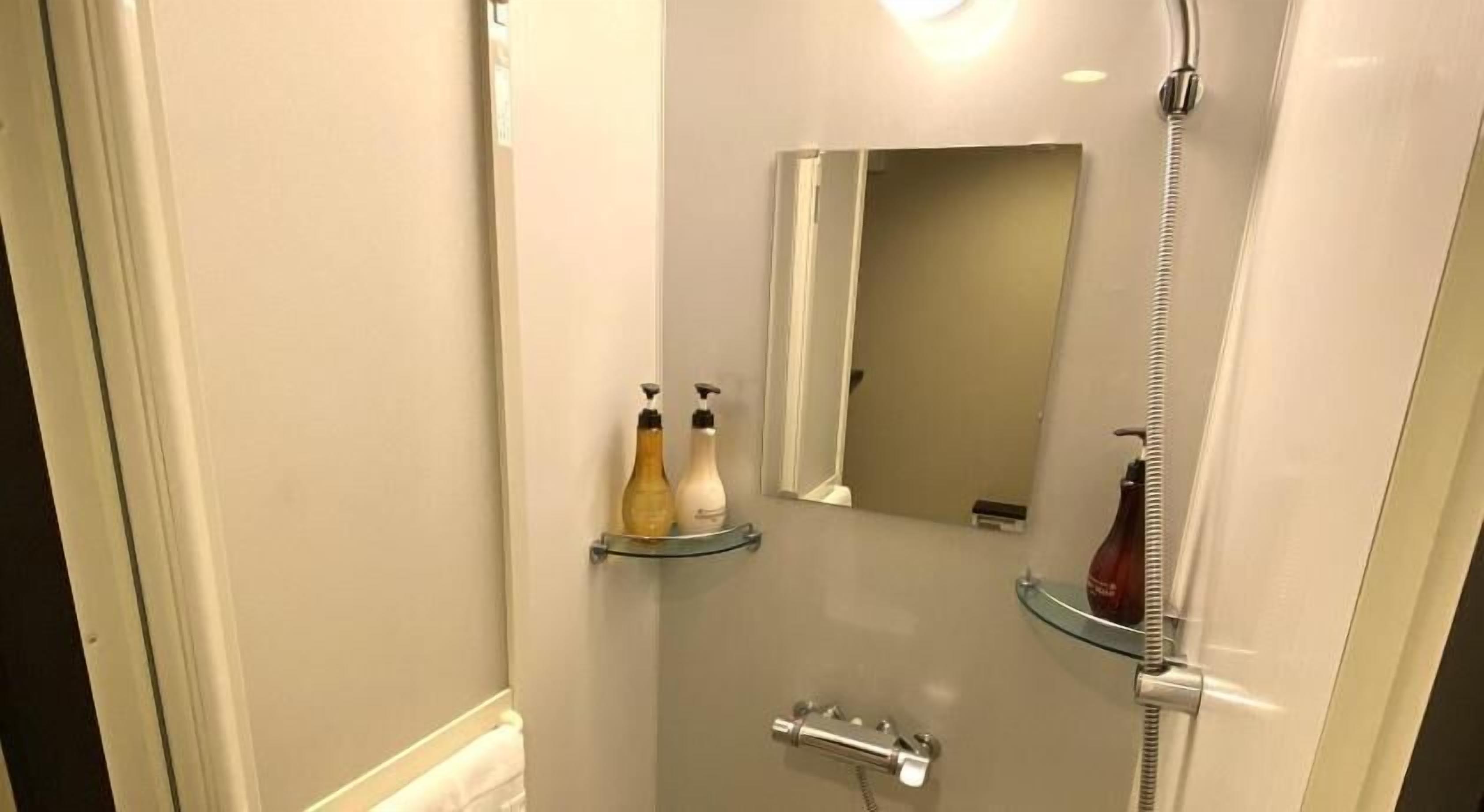 Bathroom | Shower, free toiletries, hair dryer, slippers
