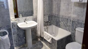 Shower, hair dryer, towels, toilet paper