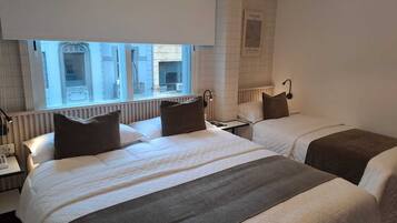 Triple Room | Minibar, in-room safe, individually furnished, desk