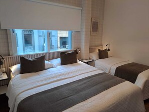 Triple Room | Minibar, in-room safe, individually furnished, desk