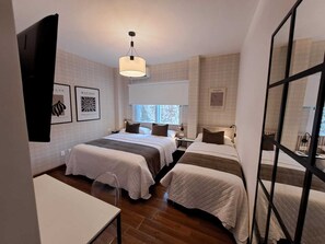 Triple Room | Minibar, in-room safe, individually furnished, desk