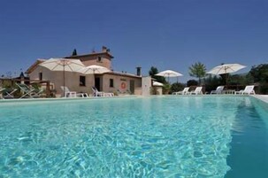 Outdoor pool, pool umbrellas, sun loungers