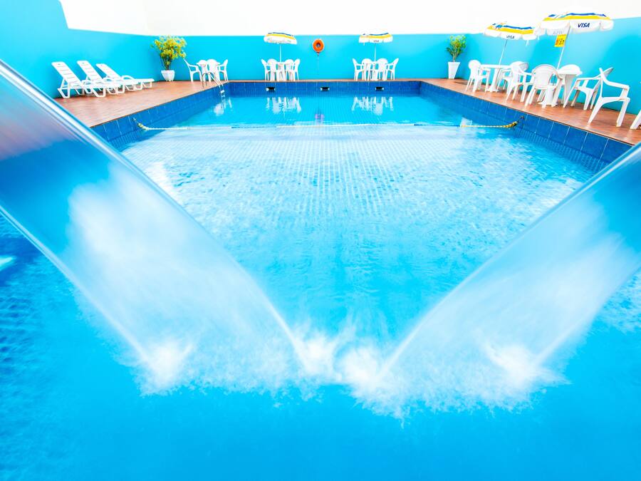Outdoor pool, open 9:00 AM to 10:00 PM, pool loungers