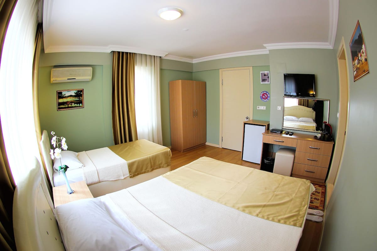 Triple Room | 1 bedroom, premium bedding, in-room safe, blackout drapes