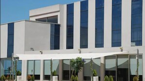 A modern building with large windows and a covered outdoor area. - Hotel Duomo (Benifayo)