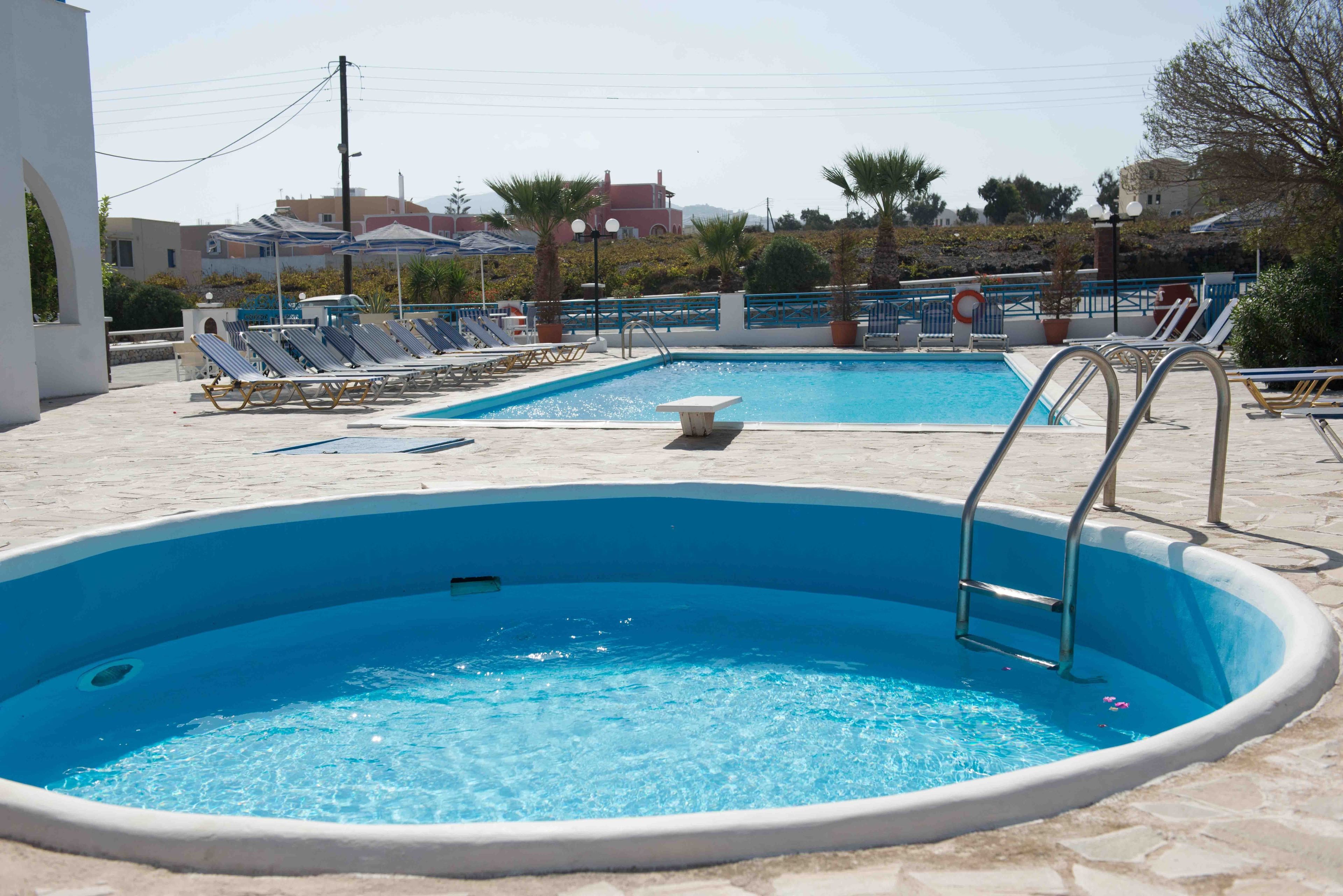 seasonal outdoor pool, pool umbrellas, pool loungers