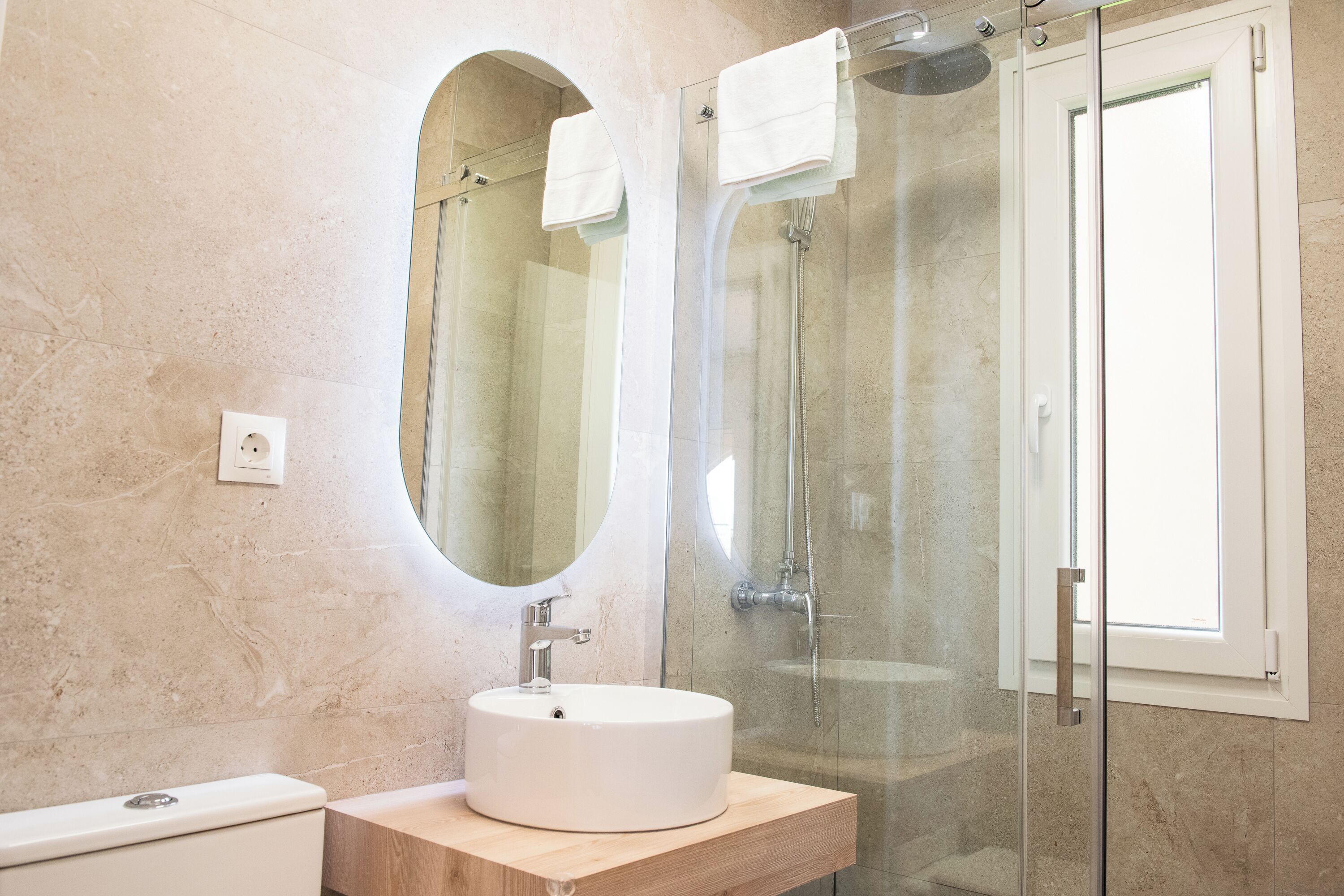 Shower, hair dryer, towels, toilet paper