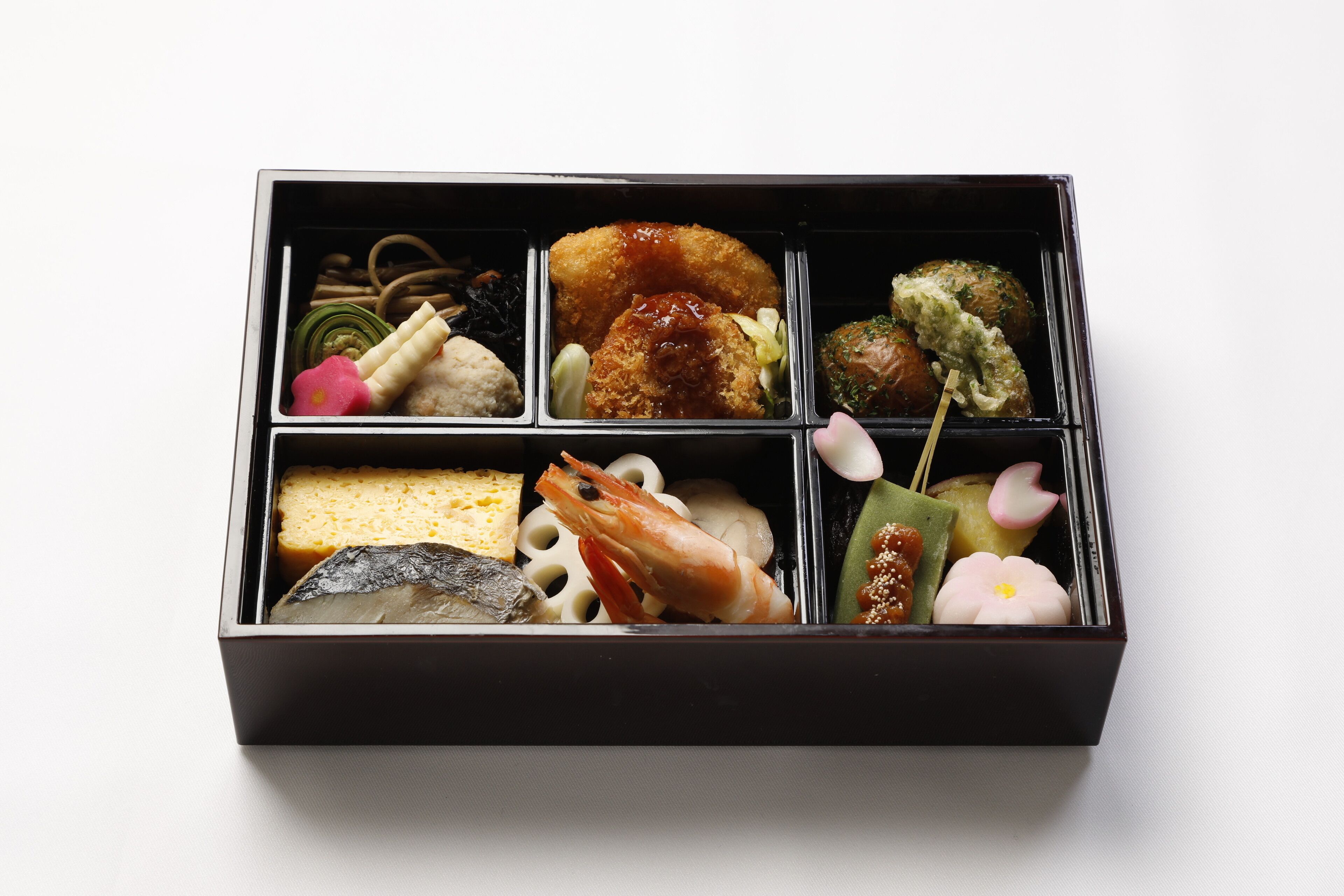 A black box containing various food items.