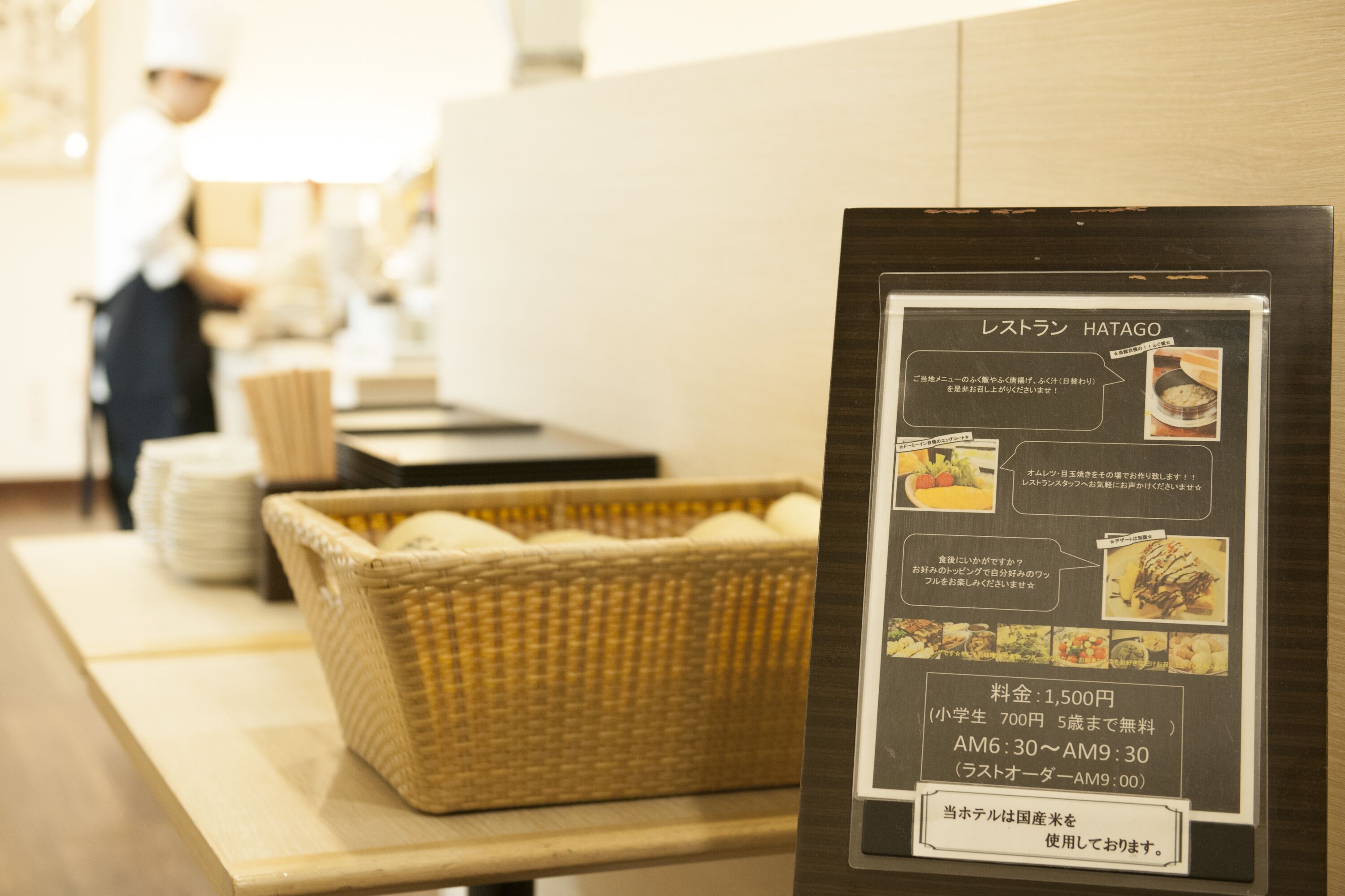 A menu board with food items and prices in a restaurant setting.