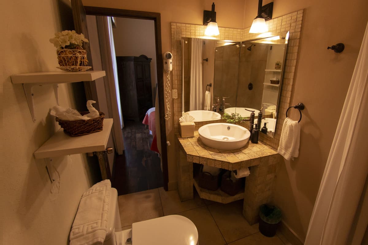 quadruple room, 2 double beds | bathroom | shower, rainfall showerhead, designer toiletries, hair dryer