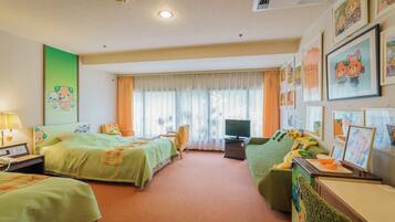 A hotel room with two beds, a television, a desk with a lamp, and various wall decorations.