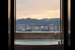 Junior Suite, Non Smoking | Bathroom | Separate tub and shower, rainfall showerhead, designer toiletries