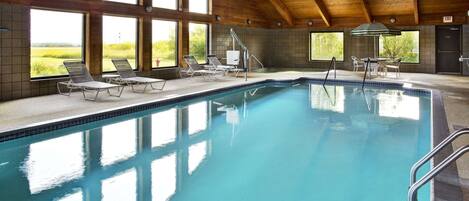 Indoor pool, open 7:00 AM to midnight, pool loungers