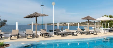 Outdoor pool, open 10:00 AM to 6:00 PM, pool umbrellas, sun loungers