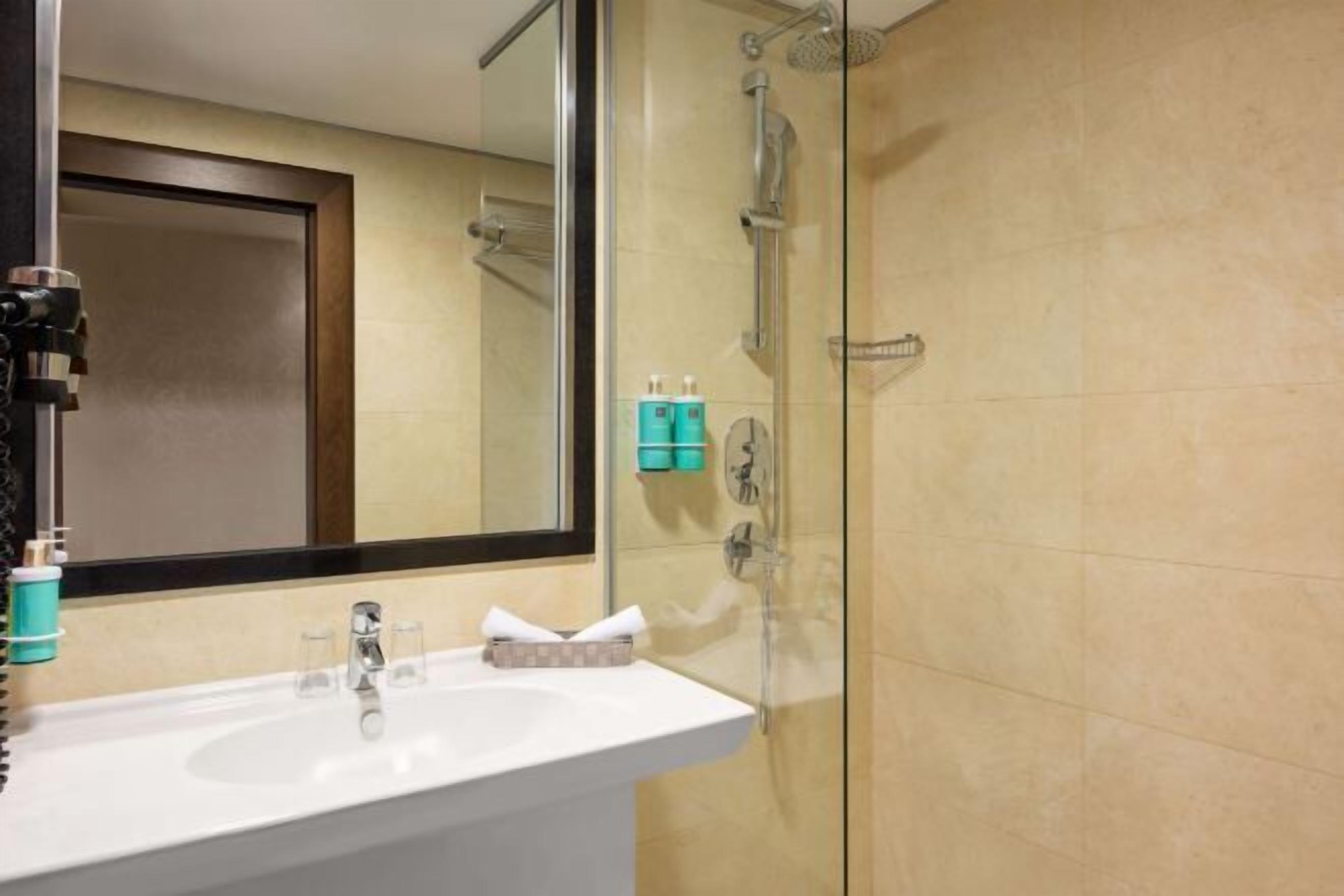 Bathroom | Eco-friendly toiletries, hair dryer, slippers, towels