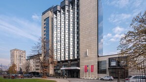 A modern hotel with a prominent vertical design, large windows, and a visible entrance with signage. - Movenpick hotel Sarajevo (Sarajevo)
