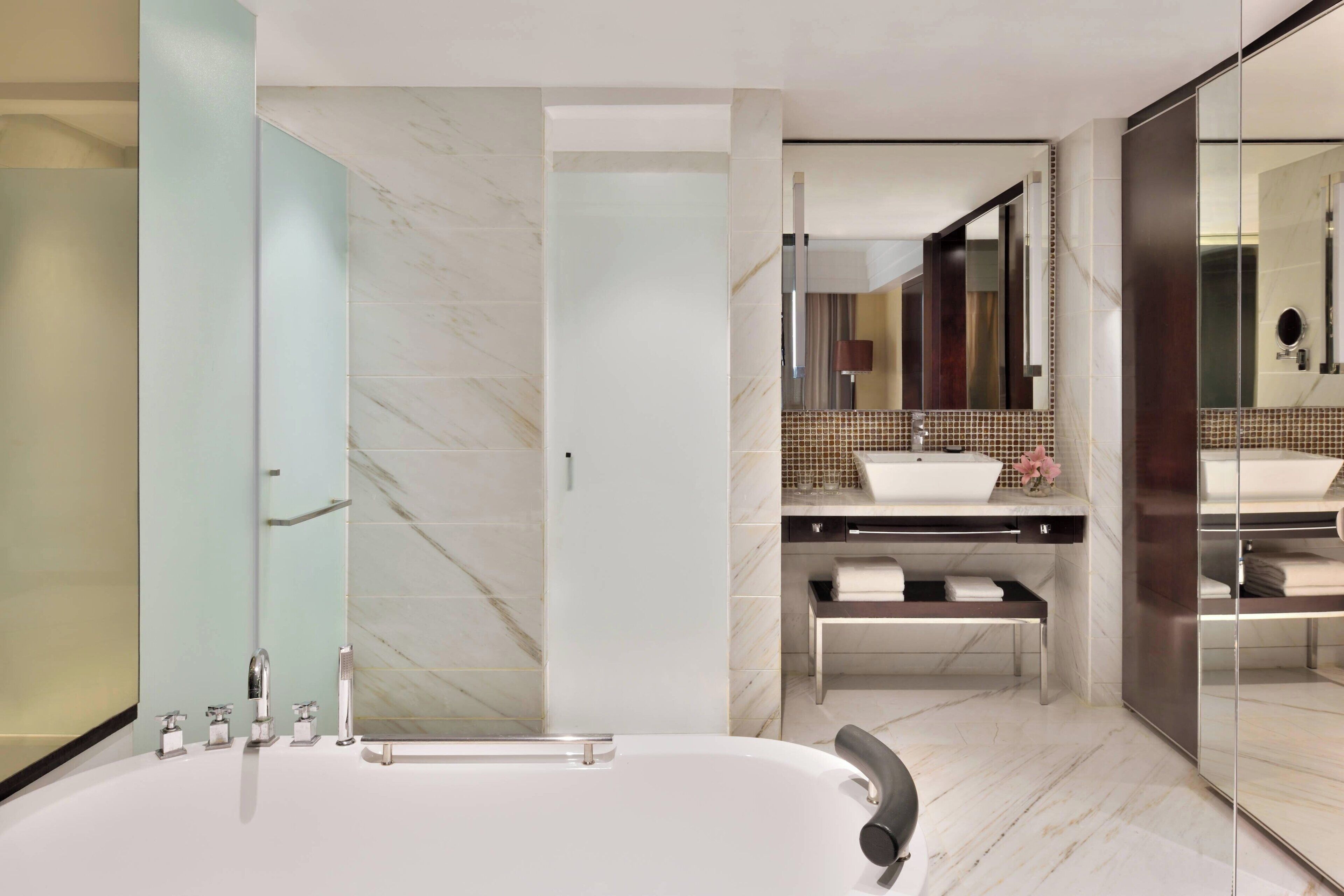 club suite, 1 king bed, non smoking | bathroom | combined shower/bathtub, deep-soaking bathtub, designer toiletries