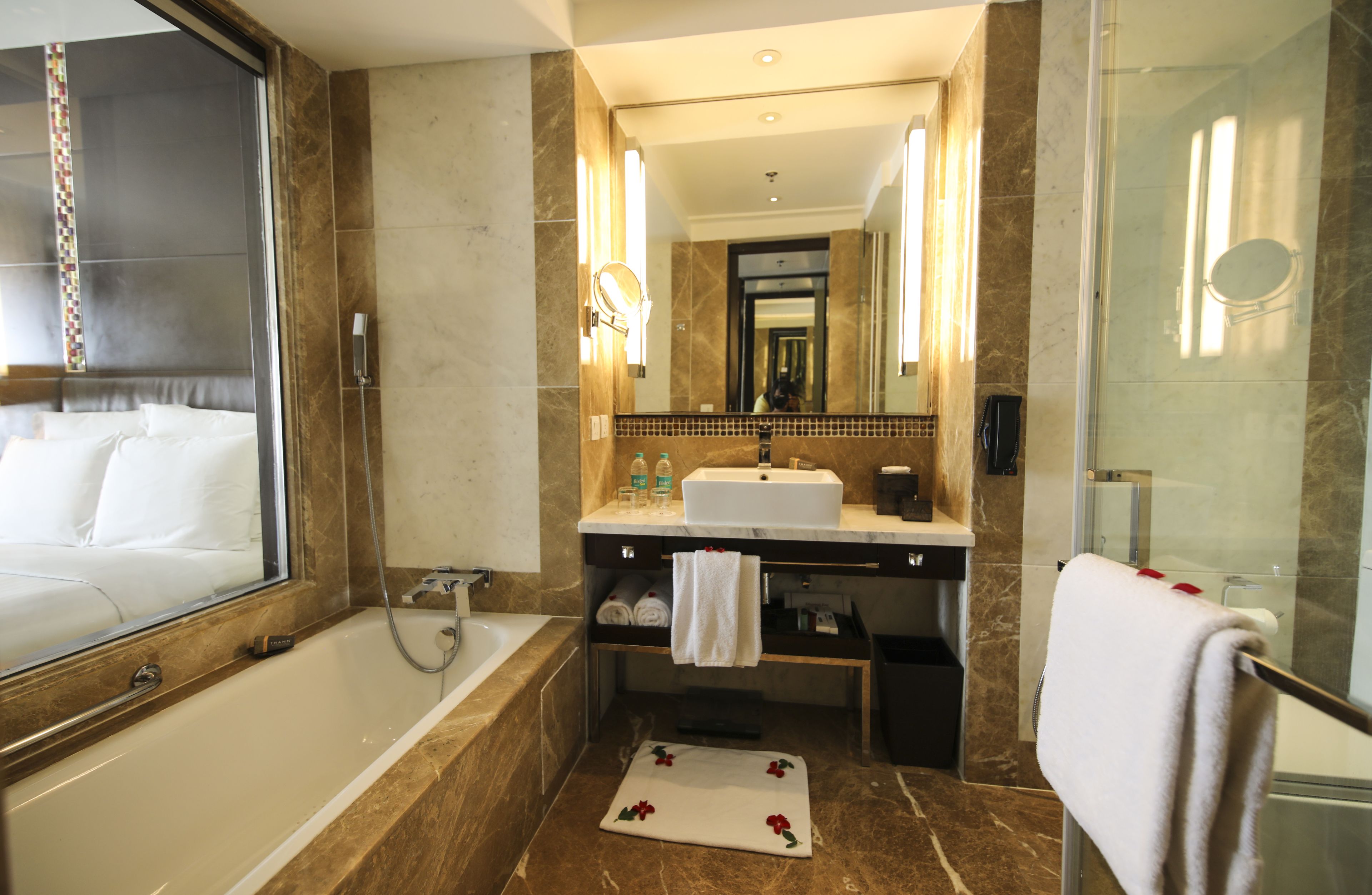 combined shower/bathtub, deep-soaking bathtub, designer toiletries