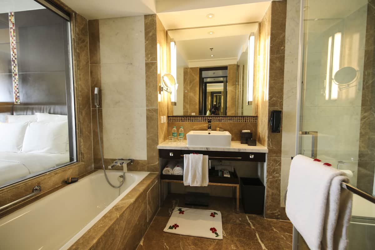 combined shower/bathtub, deep-soaking bathtub, designer toiletries