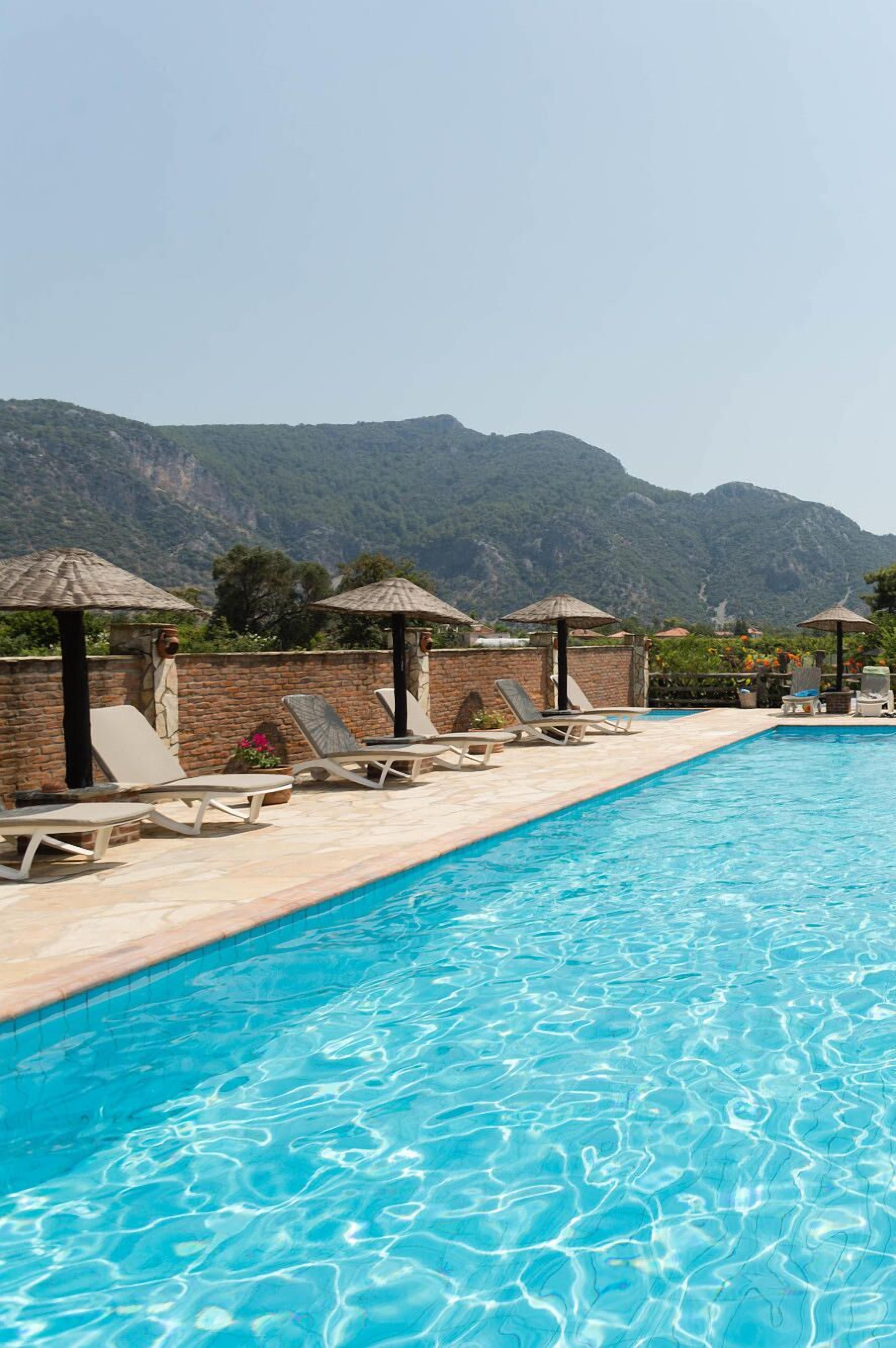 seasonal outdoor pool, free pool cabanas, pool umbrellas