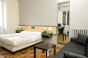 Quadruple Room | Living area | 22-inch LCD TV with digital channels, TV - Hotel Suisse Genova (Genoa)