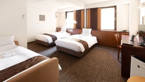 A hotel room with two beds, a desk, and a chair. - Toyo Hotel (Fukuoka)