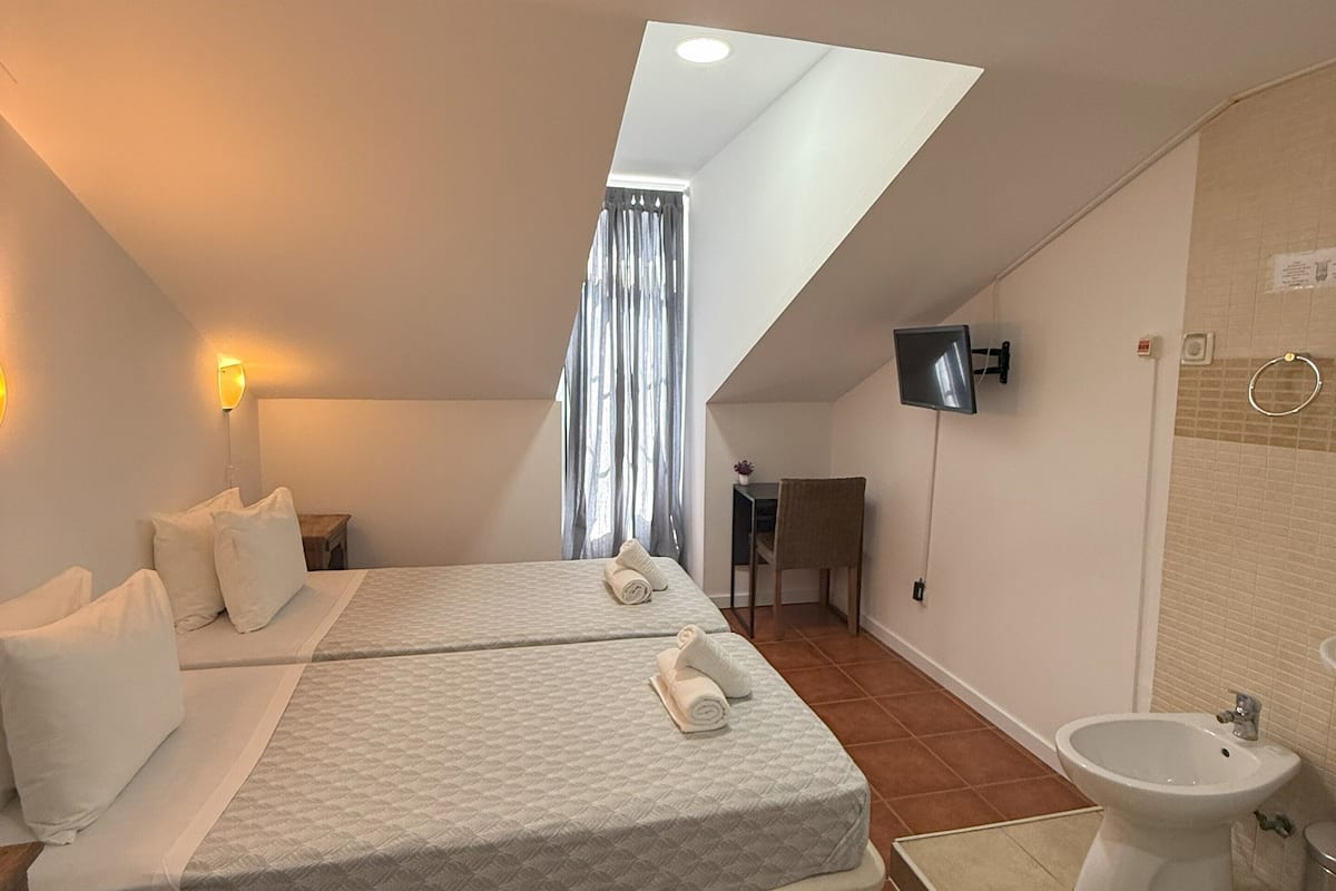 Twin Room, Shared Bathroom (with Shower, Bidet & Sink) | In-room safe, individually furnished, free WiFi, bed sheets
