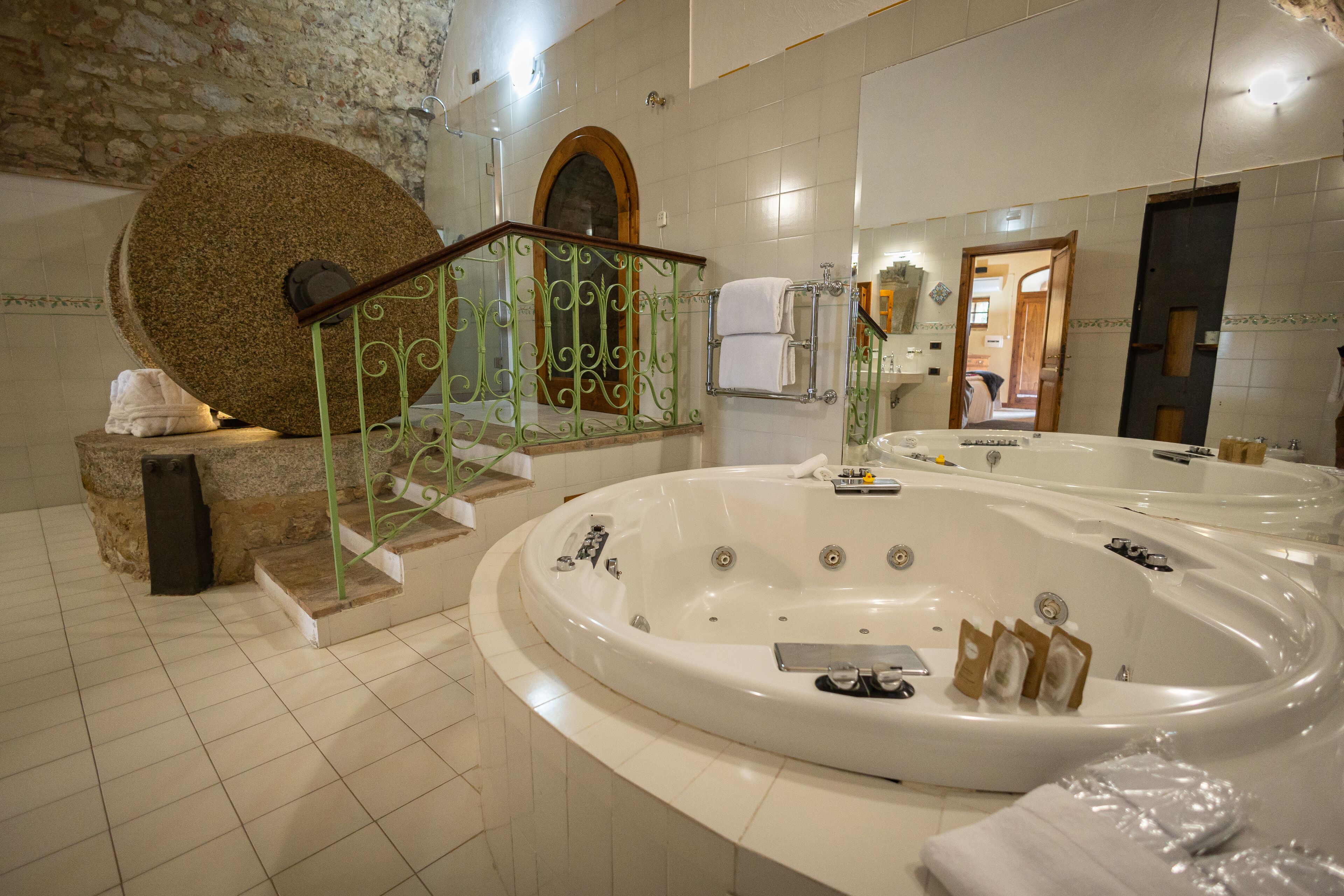 deluxe double room, 1 queen bed | bathroom | free toiletries, hair dryer, slippers, towels