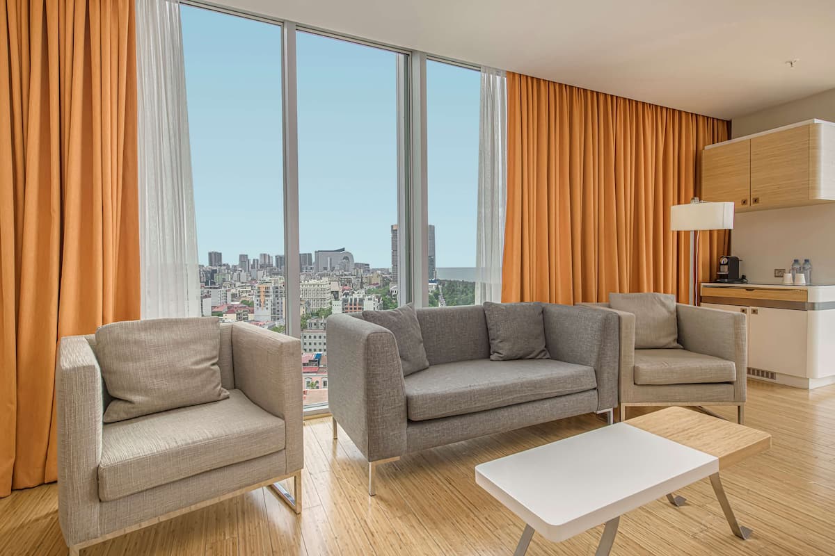 family suite, sea view | minibar, in-room safe, desk, laptop workspace