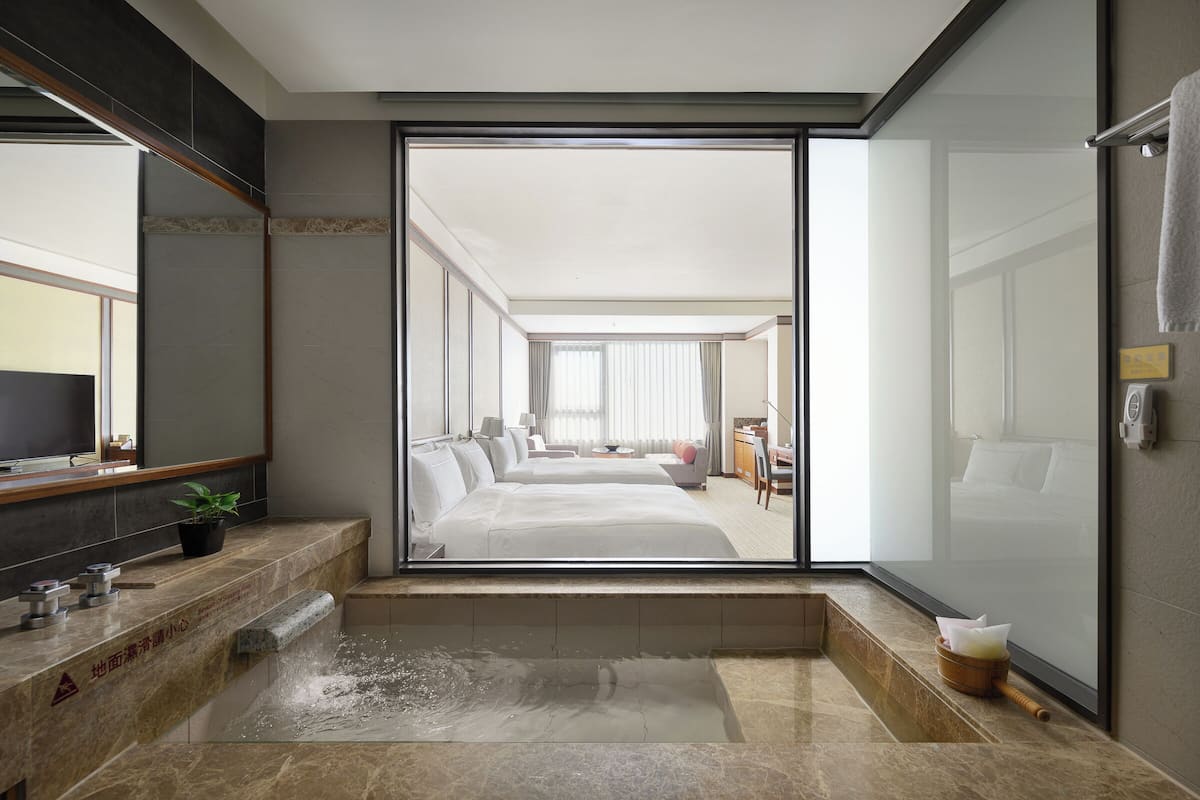 deluxe family room | bathroom | separate bathtub and shower, spring water bathtub, rainfall showerhead