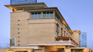 A large, modern building with a prominent sign reading "MAJESTIC COURT SAROVAR PORTICO". - Majestic Court Sarovar Portico Navi Mumbai (Navi Mumbai)