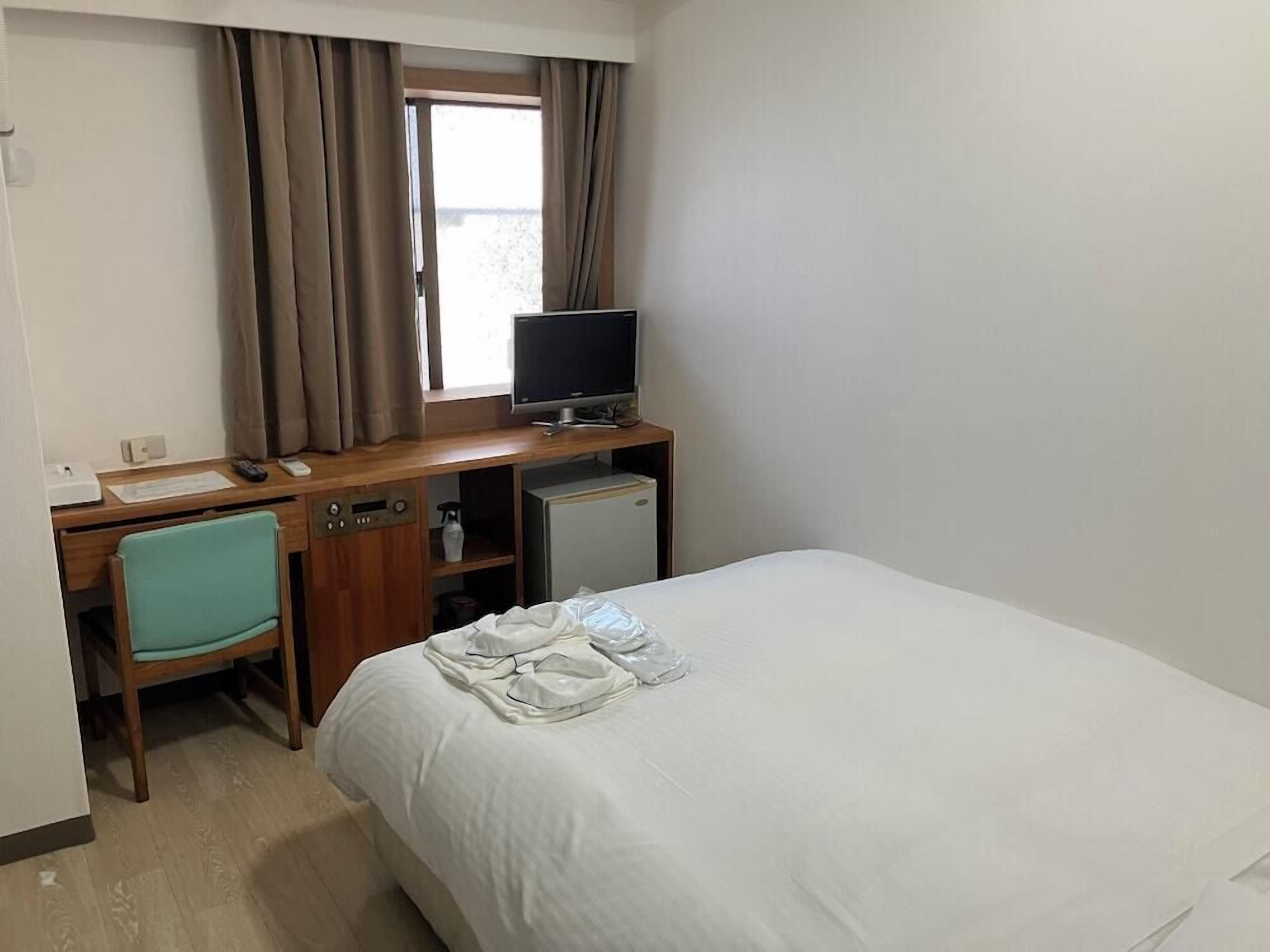 Desk, blackout curtains, free WiFi, bed sheets