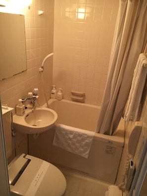 Combined shower/bathtub, free toiletries, hair dryer, bathrobes