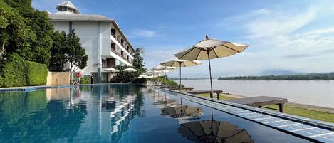 Outdoor pool, open 8:00 AM to 7:00 PM, sun loungers