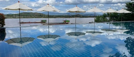 Outdoor pool, open 8:00 AM to 7:00 PM, pool loungers