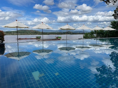 Outdoor pool, open 8:00 AM to 7:00 PM, sun loungers