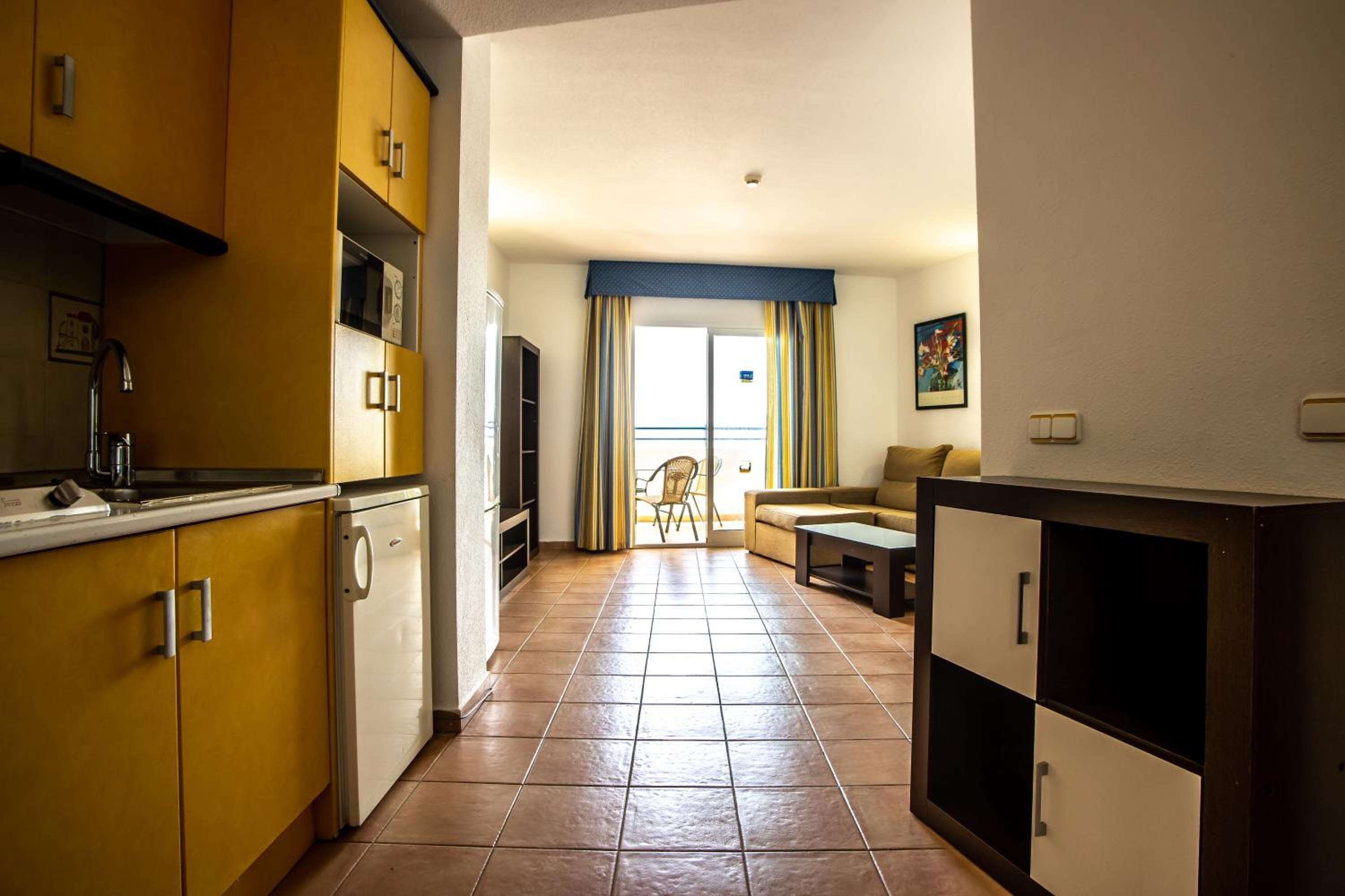 Full-sized fridge, microwave, stovetop, cookware/dishes/utensils