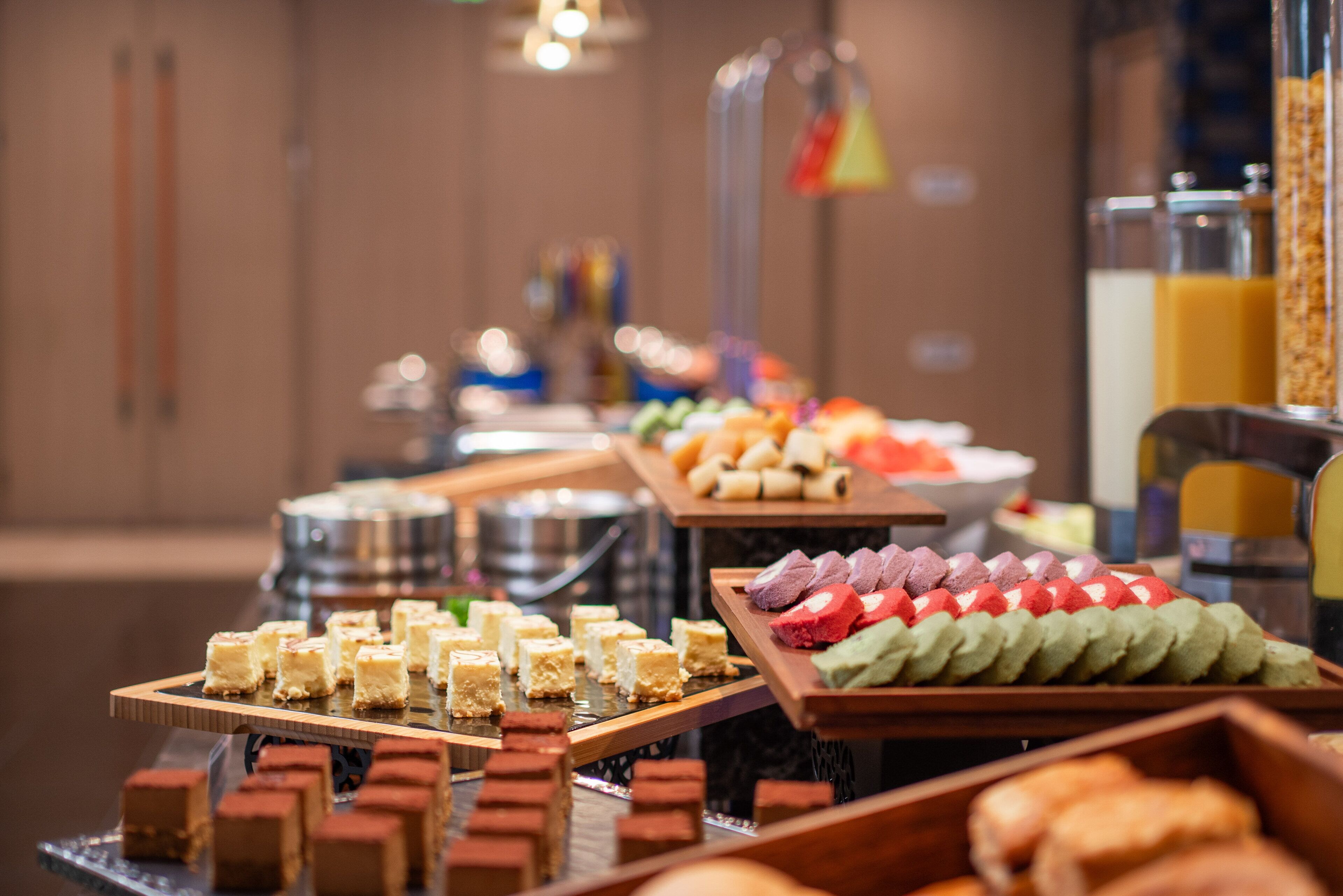 A buffet with various desserts and pastries.