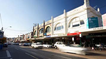 A street with buildings, including a visible sign for 'Don Arcade'.