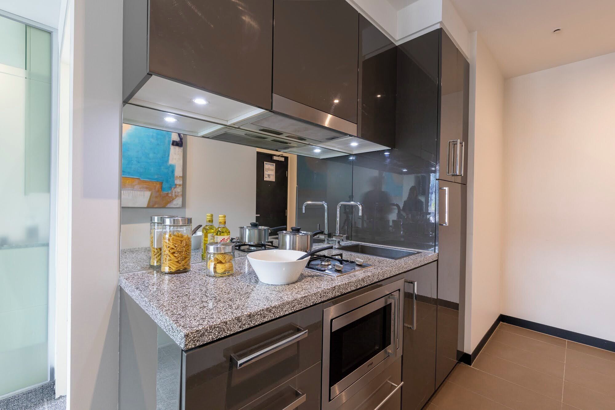 Fridge, microwave, stovetop, coffee/tea maker