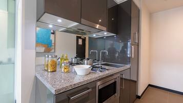 Fridge, microwave, stovetop, coffee/tea maker