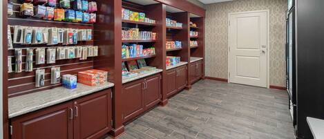 A pharmacy with shelves stocked with various health and hygiene products.